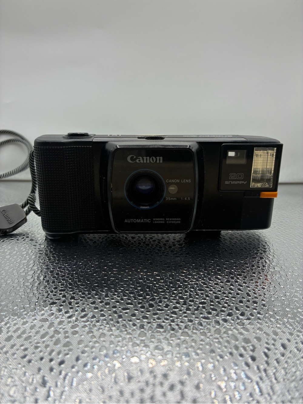 Canon Compact 35mm Point-and-Shoot Camera — Black with Orange Accent